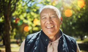 Senior man in a park, out for a morning walk.